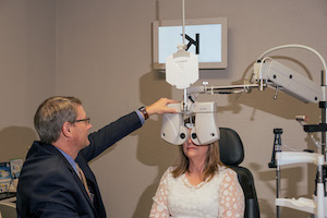 Dr. Kent Wilson conducting an eye exam